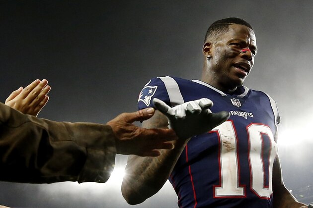 FILE - In this Dec. 2, 2018, file photo, New England Patriots wide receiver Josh Gordon is congratulated after an NFL football game against the Minnesota Vikings at Gillette Stadium, in Foxborough, Mass. Patriots receiver Josh Gordon says he is stepping away from football in order to focus on his mental health. In a statement posted on Twitter on Thursday morning, Dec. 20, 2018, Gordon said his decision was spurred by him feeling recently that he could have a better grasp on things mentally. He thanked the Patriots for their support and vowed to work his way back. (AP Photo/Winslow Townson, File)