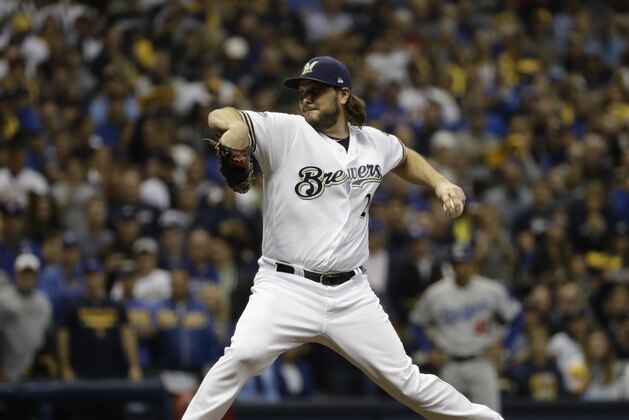 Milwaukee Brewers' Wade Miley throws during the first inning of Game 6 of the National League Championship Series baseball game against the Los Angeles Dodgers Friday, Oct. 19, 2018, in Milwaukee. (AP Photo/Matt Slocum)