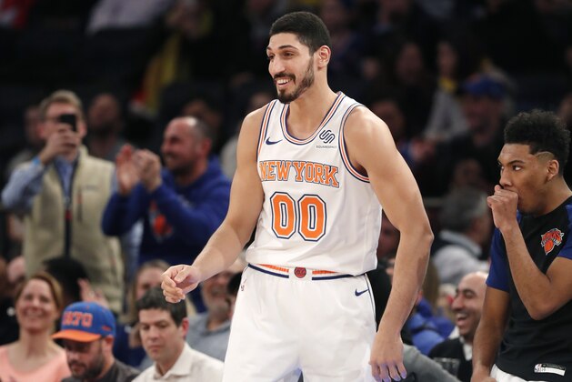New York Knicks center Enes Kanter (00) smiles as the crowd acknowledges his presence on the court during the second half of an NBA basketball game against the Dallas Mavericks, Wednesday, Jan. 30, 2019, in New York. The Mavericks defeated the Knicks 114-90. (AP Photo/Kathy Willens) New York Knicks center Enes Kanter (00) smiles as the crowd acknowledges his presence on the court during the second half of an NBA basketball game against the Dallas Mavericks, Wednesday, Jan. 30, 2019, in New York. The Mavericks defeated the Knicks 114-90. (AP Photo/Kathy Willens)