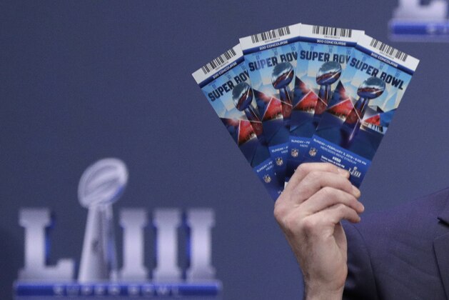 Michael, Buchwald, NFL Senior Counsel, Legal, holds up Super Bowl 53 tickets as he explains the security features on the tickets during a news conference for the NFL Super Bowl 53 football game Thursday, Jan. 31, 2019, in Atlanta. (AP Photo/David J. Phillip)