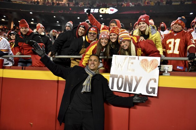 Kansas City Chiefs former player Tony Gonzalez poses with fans in the stands after he was inducted to the Chiefs Hall fo Fame, at a ceremony at halftime of an NFL football game against the Los Angeles Chargers in Kansas City, Mo., Thursday, Dec. 13, 2018. (AP Photo/Ed Zurga)