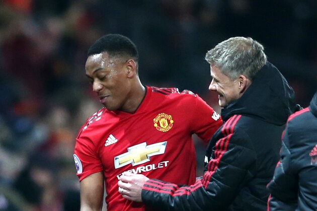MANCHESTER, ENGLAND - JANUARY 19:  Anthony Martial of Manchester United speaks to Ole Gunnar Solskjaer, Interim Manager of Manchester United after being subbed during the Premier League match between Manchester United and Brighton & Hove Albion at Old Trafford on January 19, 2019 in Manchester, United Kingdom.  (Photo by Jan Kruger/Getty Images)