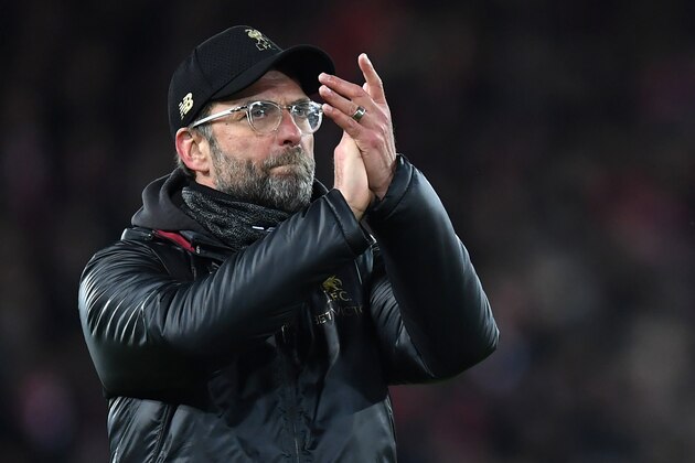 Liverpool's German manager Jurgen Klopp applauds supporters on the pitch after the English Premier League football match between Liverpool and Leicester City at Anfield in Liverpool, north west England on January 30, 2019. - The game finished 1-1. (Photo by Paul ELLIS / AFP) / RESTRICTED TO EDITORIAL USE. No use with unauthorized audio, video, data, fixture lists, club/league logos or 'live' services. Online in-match use limited to 120 images. An additional 40 images may be used in extra time. No video emulation. Social media in-match use limited to 120 images. An additional 40 images may be used in extra time. No use in betting publications, games or single club/league/player publications. / (Photo credit should read PAUL ELLIS/AFP/Getty Images) Liverpool's German manager Jurgen Klopp applauds supporters on the pitch after the English Premier League football match between Liverpool and Leicester City at Anfield in Liverpool, north west England on January 30, 2019. - The game finished 1-1. (Photo by Paul ELLIS / AFP) / RESTRICTED TO EDITORIAL USE. No use with unauthorized audio, video, data, fixture lists, club/league logos or 'live' services. Online in-match use limited to 120 images. An additional 40 images may be used in extra time. No video emulation. Social media in-match use limited to 120 images. An additional 40 images may be used in extra time. No use in betting publications, games or single club/league/player publications. / (Photo credit should read PAUL ELLIS/AFP/Getty Images)