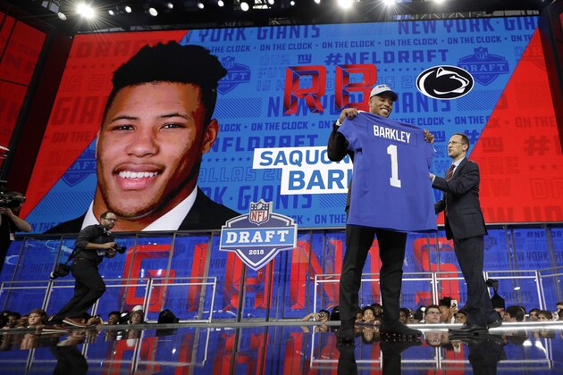 Penn State's Saquon Barkley poses after being selected by the New York Giants during the first round of the NFL football draft, Thursday, April 26, 2018, in Arlington, Texas. (AP Photo/David J. Phillip)