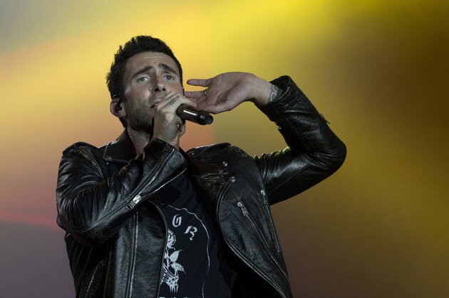 FILE - In this Sept. 16, 2017, file photo, Adam Levine of Maroon 5 performs at the Rock in Rio music festival in Rio de Janeiro, Brazil. Big Boi and Travis Scott will join Maroon 5 in this year’s Super Bowl halftime show. Maroon 5 had been the widely reported halftime show act since September, but the NFL officially announced the band as its headliner Sunday, Jan. 13, 2019. (AP Photo/Silvia Izquierdo, File)