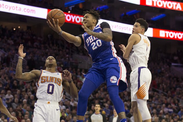 PHILADELPHIA, PA - NOVEMBER 19: Markelle Fultz #20 of the Philadelphia 76ers shoots the ball against Isaiah Canaan #0 and Devin Booker #1 of the Phoenix Suns at the Wells Fargo Center on November 19, 2018 in Philadelphia, Pennsylvania. NOTE TO USER: User expressly acknowledges and agrees that, by downloading and or using this photograph, User is consenting to the terms and conditions of the Getty Images License Agreement. (Photo by Mitchell Leff/Getty Images)