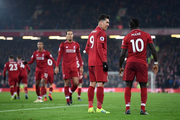 LIVERPOOL, ENGLAND - JANUARY 19:  Sadio Mane of Liverpool celebrates with Roberto Firmino after scoring his sides fourth goal during the Premier League match between Liverpool FC and Crystal Palace at Anfield on January 19, 2019 in Liverpool, United Kingdom.  (Photo by Laurence Griffiths/Getty Images)