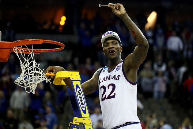 OMAHA, NE - MARCH 25:  Silvio De Sousa #22 of the Kansas Jayhawks celebrates cutting down the net after defeating the Duke Blue Devils with a score of 81 to 85 in the 2018 NCAA Men's Basketball Tournament Midwest Regional at CenturyLink Center on March 25, 2018 in Omaha, Nebraska.  (Photo by Jamie Squire/Getty Images)