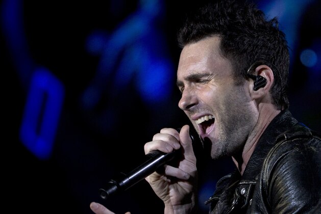 Adam Levine of Maroon 5 performs at the Rock in Rio music festival in Rio de Janeiro, Brazil, Saturday, Sept. 16, 2017. (AP Photo/Silvia Izquierdo)35
