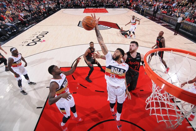 PORTLAND, OR - JANUARY 18: Anthony Davis #23 of the New Orleans Pelicans reaches for the rebound against the Portland Trail Blazers on January 18, 2019 at the Moda Center Arena in Portland, Oregon. NOTE TO USER: User expressly acknowledges and agrees that, by downloading and or using this photograph, user is consenting to the terms and conditions of the Getty Images License Agreement. Mandatory Copyright Notice: Copyright 2019 NBAE (Photo by Sam Forencich/NBAE via Getty Images)