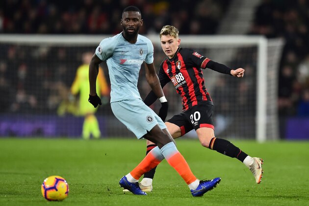 Chelsea's German defender Antonio Rudiger (L) vies with Bournemouth's English-born Welsh midfielder David Brooks during the English Premier League football match between Bournemouth and Chelsea at the Vitality Stadium in Bournemouth, southern England on January 30, 2019. (Photo by Glyn KIRK / AFP) / RESTRICTED TO EDITORIAL USE. No use with unauthorized audio, video, data, fixture lists, club/league logos or 'live' services. Online in-match use limited to 120 images. An additional 40 images may be used in extra time. No video emulation. Social media in-match use limited to 120 images. An additional 40 images may be used in extra time. No use in betting publications, games or single club/league/player publications. /         (Photo credit should read GLYN KIRK/AFP/Getty Images)