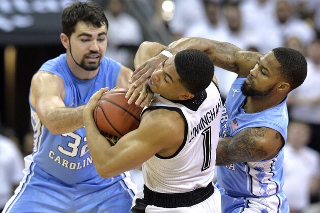 North Carolina forward Luke Maye (32) and guard Seventh Woods (0) battle Louisville guard Christen Cunningham (1) for the ball during the first half of an NCAA college basketball game in Louisville, Ky., Saturday, Feb. 2, 2019. (AP Photo/Timothy D. Easley)