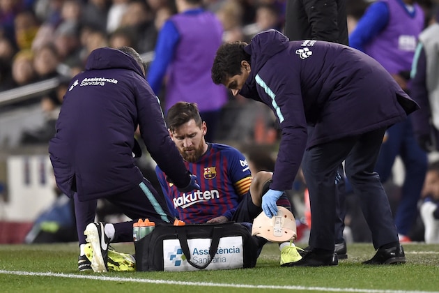 BARCELONA, SPAIN - FEBRUARY 02:  Lionel Messi of Barcelona receives medical treatment during the La Liga match between FC Barcelona and Valencia CF at Camp Nou on February 2, 2019 in Barcelona, Spain.  (Photo by Alex Caparros/Getty Images)
