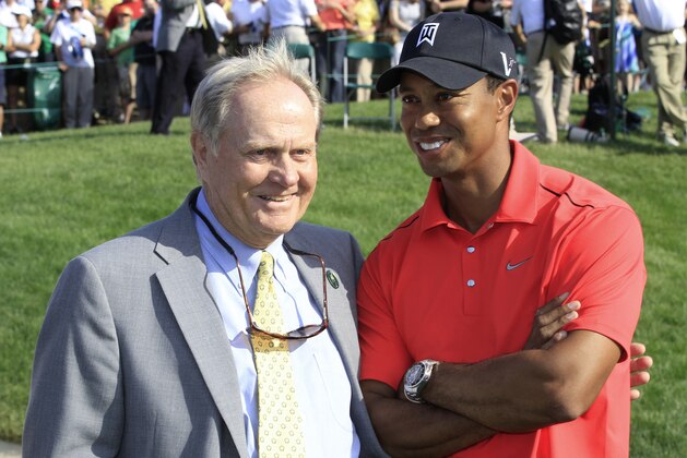 Jack Nicklaus, left, and Tiger Woods talk after Woods won the Memorial golf tournament at the Muirfield Village Golf Club in Dublin, Ohio, Sunday, June 3, 2012. (AP Photo/Tony Dejak)