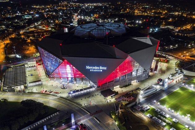 FILE-In this Friday, Sep. 21, 2018, photo, Mercedes-Benz Stadium is seen in this aerial photo in Atlanta. The stadium will be the site of Super Bowl LIII on Sunday, Feb. 3, 2019. Legions of police and federal agents will be protecting the stadium as Atlanta hosts Super Bowl 53, but recent attacks in the U.S. and around the world underscore how terrorists are striking less-secure areas outside sports stadiums, arenas and airports, experts say.(AP Photo/Danny Karnik, File)