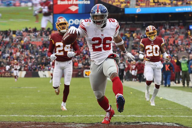 LANDOVER, MD - DECEMBER 09: Running back Saquon Barkley #26 of the New York Giants rushes for a 78-yard touchdown in the second quarter against the Washington Redskins at FedExField on December 9, 2018 in Landover, Maryland. (Photo by Patrick Smith/Getty Images)