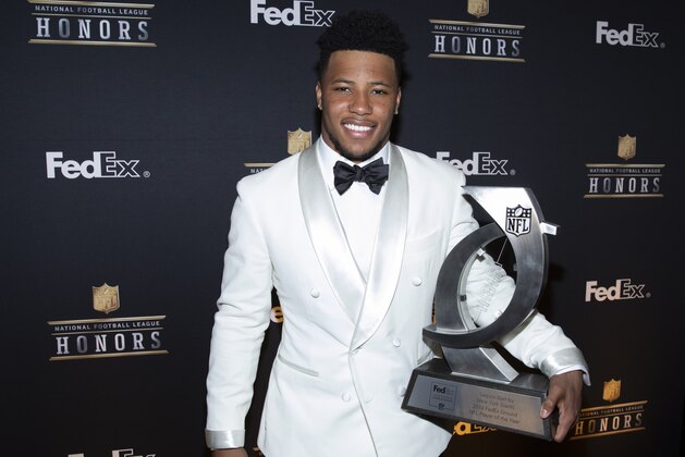 IMAGE DISTRIBUTED FOR FEDEX - Saquon Barkley, of the New York Giants, accepts the 2018 FedEx Ground Player of the Year award at the NFL Honors at the Fox Theatre on Saturday, Feb. 2, 2019, in Atlanta. FedEx donated $20,000 in his name to the USO. FedEx is the Official Delivery Service Sponsor of the NFL. (Omar Vega/AP Images for FedEx)