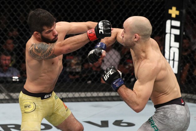 FORTALEZA, BRAZIL - FEBRUARY 02:  (R-L) Marlon Moraes of Brazil punches Raphael Assuncao of Brazil in their bantamweight fight during the UFC Fight Night event at CFO Centro de Formacao Olimpica on February 2, 2019 in Fortaleza, Brazil. (Photo by Buda Mendes/Zuffa LLC/Zuffa LLC via Getty Images)