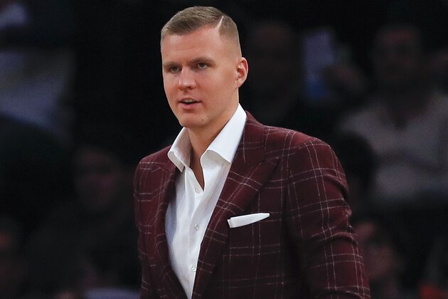New York Knicks forward Kristaps Porzingis watches play from the bench during the fourth quarter of an NBA basketball game against the Milwaukee Bucks, Saturday, Dec. 1, 2018, in New York.(AP Photo/Julie Jacobson)