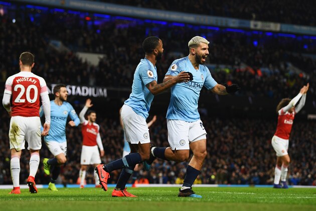 MANCHESTER, ENGLAND - FEBRUARY 03:  Sergio Aguero of Manchester City celebrates after scoring his team's third goal with Raheem Sterling during the Premier League match between Manchester City and Arsenal FC at Etihad Stadium on February 3, 2019 in Manchester, United Kingdom.  (Photo by Stu Forster/Getty Images)