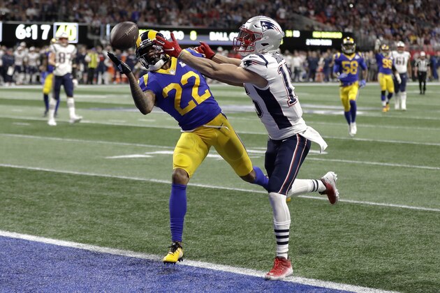 Los Angeles Rams' Marcus Peters (22), left, breaks up a pass intended for New England Patriots' Chris Hogan during the first half of the NFL Super Bowl 53 football game Sunday, Feb. 3, 2019, in Atlanta. (AP Photo/David J. Phillip)