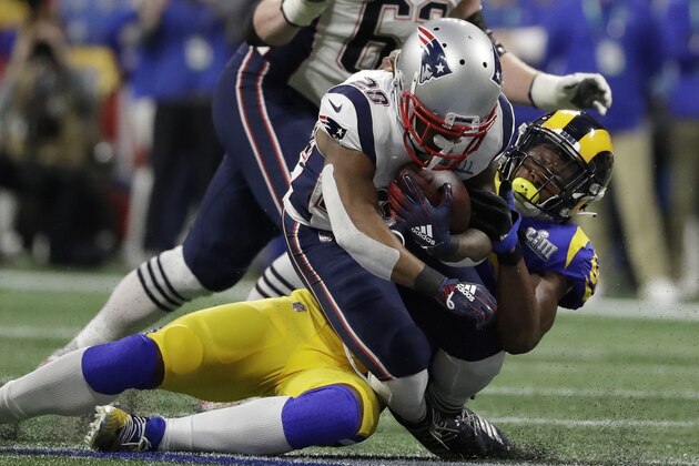 Los Angeles Rams' Dante Fowler (56) tackles New England Patriots' James White (28), during the first half of the NFL Super Bowl 53 football game Sunday, Feb. 3, 2019, in Atlanta. (AP Photo/Jeff Roberson)