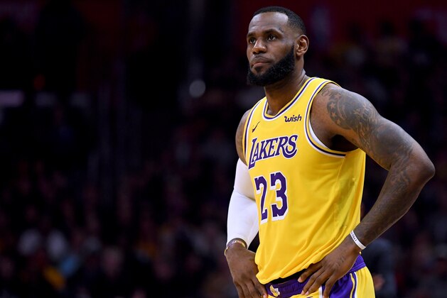 LOS ANGELES, CALIFORNIA - JANUARY 31:  LeBron James #23 of the Los Angeles Lakers waits to enter the game during a 123-120 win over the LA Clippers at Staples Center on January 31, 2019 in Los Angeles, California.  NOTE TO USER: User expressly acknowledges and agrees that, by downloading and or using this photograph, User is consenting to the terms and conditions of the Getty Images License Agreement.  (Photo by Harry How/Getty Images)
