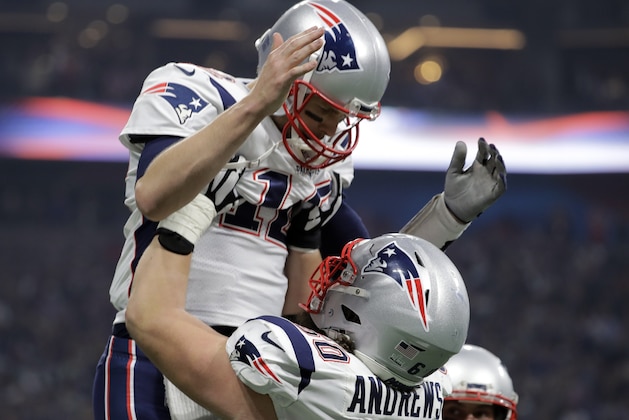 New England Patriots' David Andrews (60) picks up Tom Brady (12) after the Patriots scored a touchdown during the second half of the NFL Super Bowl 53 football game against the Los Angeles Rams Sunday, Feb. 3, 2019, in Atlanta. (AP Photo/Jeff Roberson)