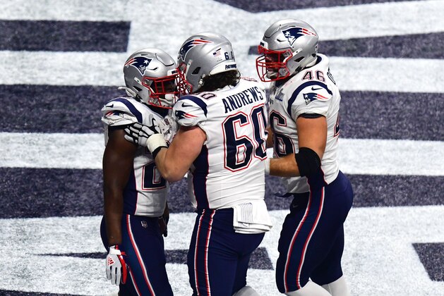 ATLANTA, GEORGIA - FEBRUARY 03:  David Andrews #60 and James Develin #46  congratulate Sony Michel #26 of the New England Patriots after his fourth quarter touchdown against Los Angeles Rams during Super Bowl LIII at Mercedes-Benz Stadium on February 03, 2019 in Atlanta, Georgia. (Photo by Scott Cunningham/Getty Images)