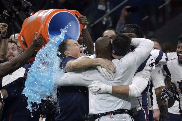 New England Patriots head coach Bill Belichick gets doused after the NFL Super Bowl 53 football game against the Los Angeles Rams, Sunday, Feb. 3, 2019, in Atlanta. The Patriots won 13-3. (AP Photo/Patrick Semansky)