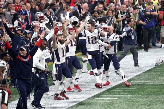 ATLANTA, GEORGIA - FEBRUARY 03:  Tom Brady #12 and Chris Hogan #15 of the New England Patriots celebrate a missed field goal late in the fourth quarter against the Los Angeles Ramsduring Super Bowl LIII at Mercedes-Benz Stadium on February 03, 2019 in Atlanta, Georgia. (Photo by Streeter Lecka/Getty Images)