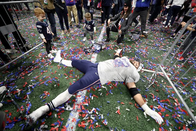 ATLANTA, GA - FEBRUARY 03:  James Develin #46 of the New England Patriots celebrates with his kids James III and William Robert Develin after the Super Bowl LIII against the Los Angeles Rams at Mercedes-Benz Stadium on February 3, 2019 in Atlanta, Georgia. The New England Patriots defeat the Los Angeles Rams 13-3.  (Photo by Jamie Squire/Getty Images)