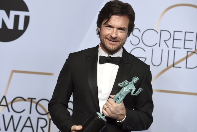 Jason Bateman poses with the award for outstanding performance by a male actor in a drama series for