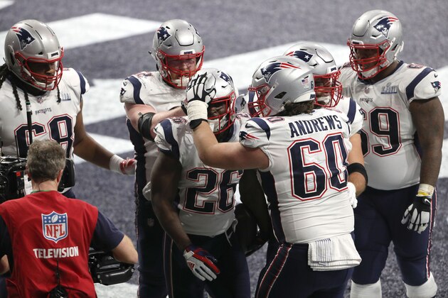 ATLANTA, GEORGIA - FEBRUARY 03:  David Andrews #60 and James Develin #46  congratulate Sony Michel #26 of the New England Patriots after his fourth quarter touchdown against Los Angeles Rams during Super Bowl LIII at Mercedes-Benz Stadium on February 03, 2019 in Atlanta, Georgia. (Photo by Patrick Smith/Getty Images)