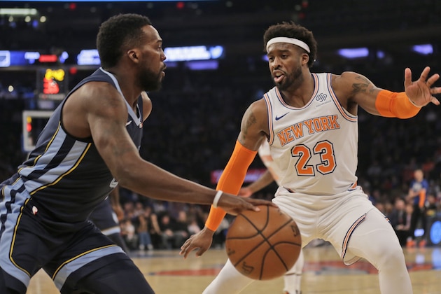 New York Knicks' Wesley Matthews, right, defends during the first half of the NBA basketball game against the Memphis Grizzlies, Sunday, Feb. 3, 2019, in New York. (AP Photo/Seth Wenig)