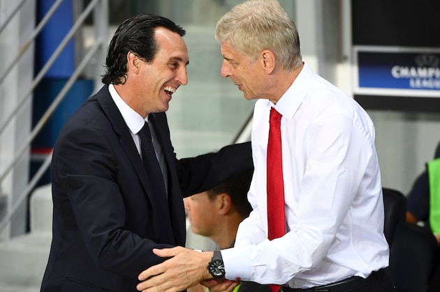 Paris Saint-Germain's Spanish head coach Unai Emery (L) shakes hands with Arsenal's French manager Arsene Wenger during the UEFA Champions League Group A football match between Paris-Saint-Germain and Arsenal FC on September 13, 2016 at the Parc des Princes stadium in Paris.  / AFP / FRANCK FIFE        (Photo credit should read FRANCK FIFE/AFP/Getty Images)