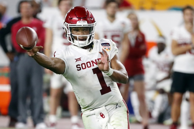 FILE - In this Dec. 29, 2018, file photo, Oklahoma quarterback Kyler Murray throws a pass during the second half of the Orange Bowl NCAA college football game against Alabama in Miami Gardens, Fla. The Oakland Athletics remain hopeful of seeing Heisman Trophy winner Murray in their baseball uniform when spring training begins next month. While the Oklahoma quarterback declared for the NFL draft last week, the prized outfielder could report to A’s spring training in Mesa, Arizona--and he has an invite to big league camp. (AP Photo/Wilfredo Lee, File)