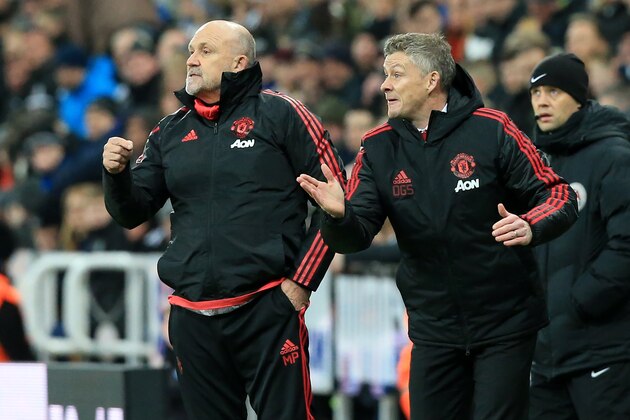 Manchester United's  Norwegian caretaker manager Ole Gunnar Solskjaer (R) and Manchester United's English first-team coach Mike Phelan shout instructions to the players from the touchline during the English Premier League football match between Newcastle United and Manchester United at St James' Park in Newcastle-upon-Tyne, north east England on January 2, 2019. (Photo by Lindsey PARNABY / AFP) / RESTRICTED TO EDITORIAL USE. No use with unauthorized audio, video, data, fixture lists, club/league logos or 'live' services. Online in-match use limited to 120 images. An additional 40 images may be used in extra time. No video emulation. Social media in-match use limited to 120 images. An additional 40 images may be used in extra time. No use in betting publications, games or single club/league/player publications. /         (Photo credit should read LINDSEY PARNABY/AFP/Getty Images)