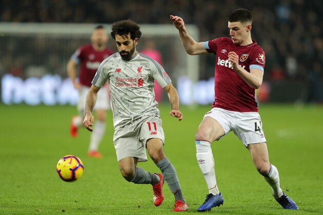 LONDON, ENGLAND - FEBRUARY 04: Mohamed Salah of Liverpool battles for possession with Declan Rice of West Ham United during the Premier League match between West Ham United and Liverpool FC at London Stadium on February 04, 2019 in London, United Kingdom. (Photo by Richard Heathcote/Getty Images)
