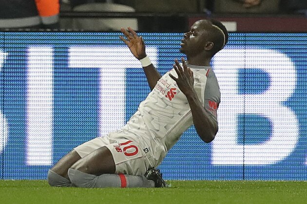 Liverpool's Sadio Mane celebrates after scoring his side's first goal during the English Premier League soccer match between West Ham United and Liverpool at the London Stadium in London, Monday, Feb. 4, 2019.(AP Photo/Kirsty Wigglesworth)