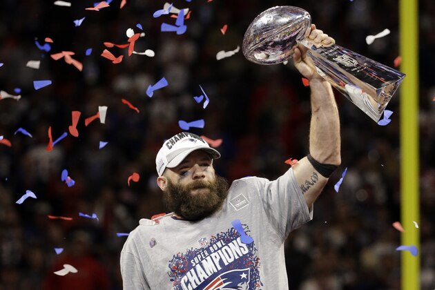 New England Patriots' Julian Edelman (11) holds the Vince Lombardi Trophy after the NFL Super Bowl 53 football game against the Los Angeles Rams, Sunday, Feb. 3, 2019, in Atlanta. The Patriots won 13-3. Edelman was named the Most Valuable Player. (AP Photo/Mark Humphrey)