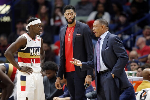 New Orleans Pelicans head coach Alvin Gentry talks to forward Anthony Davis and guard Jrue Holiday (11) in the second half of an NBA basketball game against the Detroit Pistons in New Orleans, Wednesday, Jan. 23, 2019. The Pistons won 98-94. (AP Photo/Gerald Herbert)