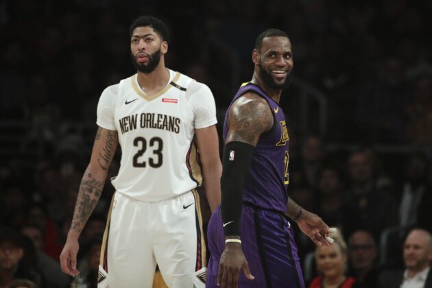Los Angeles Lakers' LeBron James, right, smiles as he walks past New Orleans Pelicans' Anthony Davis during the first half of an NBA basketball game Friday, Dec. 21, 2018, in Los Angeles. (AP Photo/Jae C. Hong) Los Angeles Lakers' LeBron James, right, smiles as he walks past New Orleans Pelicans' Anthony Davis during the first half of an NBA basketball game Friday, Dec. 21, 2018, in Los Angeles. (AP Photo/Jae C. Hong)