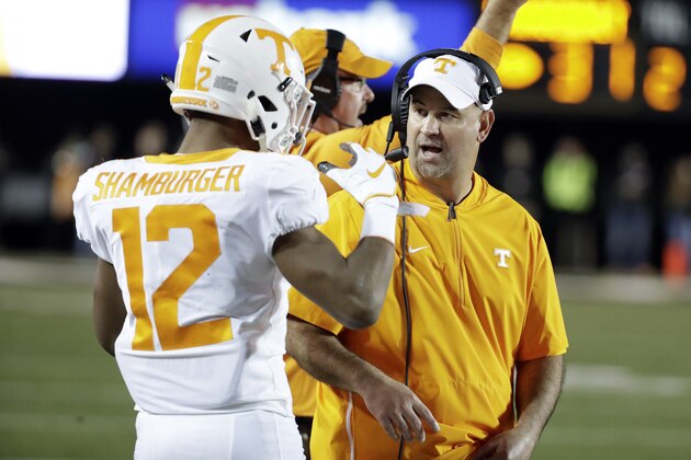 Tennessee head coach Jeremy Pruitt talks with defensive back Shawn Shamburger (12) in the second half of an NCAA college football game against Vanderbilt Saturday, Nov. 24, 2018, in Nashville, Tenn. Vanderbilt won 38-13. (AP Photo/Mark Humphrey)