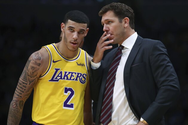 Los Angeles Lakers coach Luke Walton, right, speaks to Lonzo Ball (2) during the second half of the team's preseason NBA basketball game against the Golden State Warriors on Friday, Oct. 12, 2018, in San Jose, Calif. (AP Photo/Ben Margot)