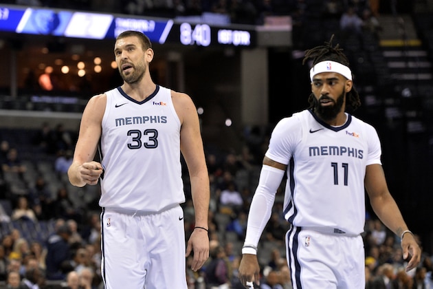 Memphis Grizzlies center Marc Gasol (33) and guard Mike Conley (11) stand on the court between plays in the first half of an NBA basketball game against the Charlotte Hornets Wednesday, Jan. 23, 2019, in Memphis, Tenn. (AP Photo/Brandon Dill)