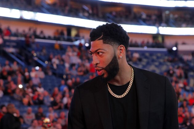 New Orleans Pelicans forward Anthony Davis walks on the court before an NBA basketball game against the Indiana Pacers in New Orleans, Monday, Feb. 4, 2019. (AP Photo/Gerald Herbert)