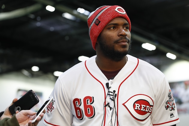 Cincinnati Reds Yasiel Puig takes questions from reporters during a media availability at the P&G MLB Cincinnati Reds Youth Academy, Wednesday, Jan. 30, 2019, in Cincinnati. (AP Photo/John Minchillo)
