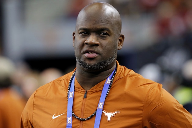 FILE - In this Dec. 1, 2018, file photo, former Texas NCAA college football quarterback Vince Young stands on the sideline during the first half of the NCAA Big 12 Conference championship against Oklahoma, in Arlington, Texas. Texas quarterback Vince Young and Notre Dame speedster Raghib Ismail have been selected, Monday, Jan. 7, 2019, for induction into the College Football Hall of Fame, along with 11 other players and two coaches. (AP Photo/Roger Steinman, File)