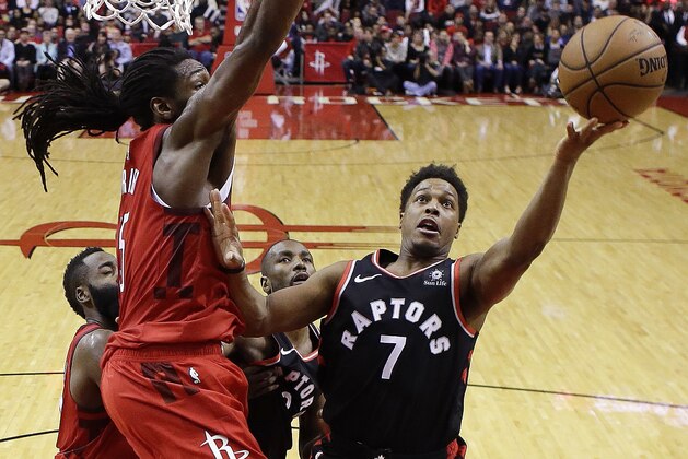 Toronto Raptors guard Kyle Lowry (7) shoots as Houston Rockets forward Kenneth Faried defends during the second half of an NBA basketball game, Friday, Jan. 25, 2019, in Houston. (AP Photo/Eric Christian Smith)
